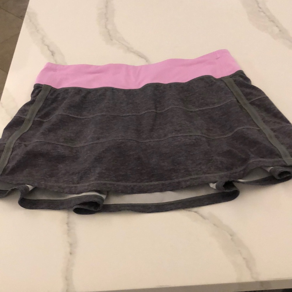 Gray tennis skirt with pink waist band